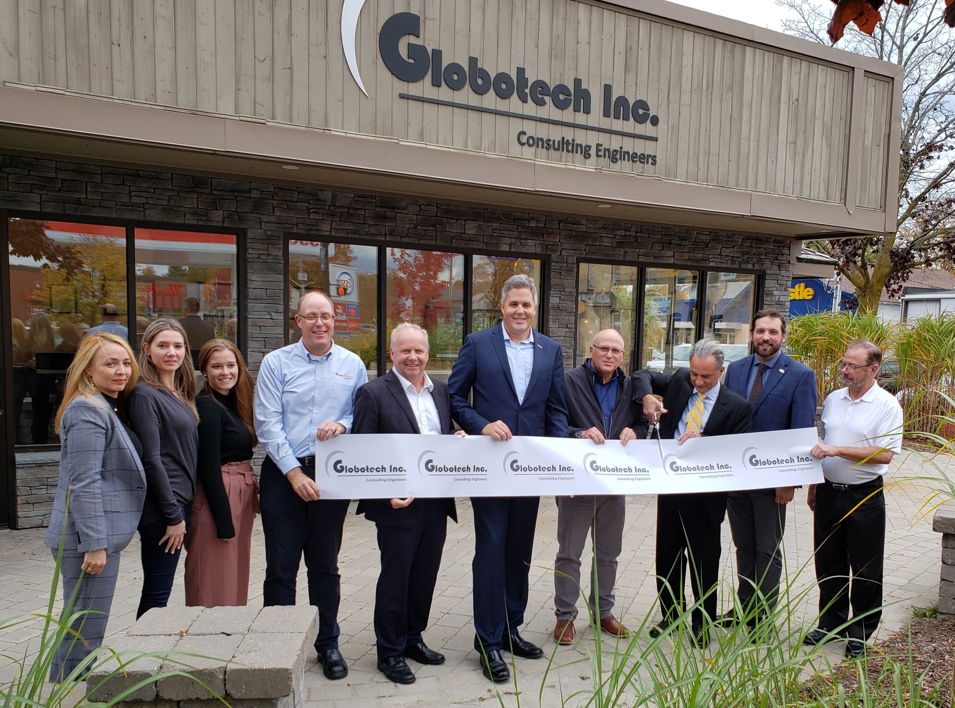 Dignitaries cut ribbon at Globotech Inc. office