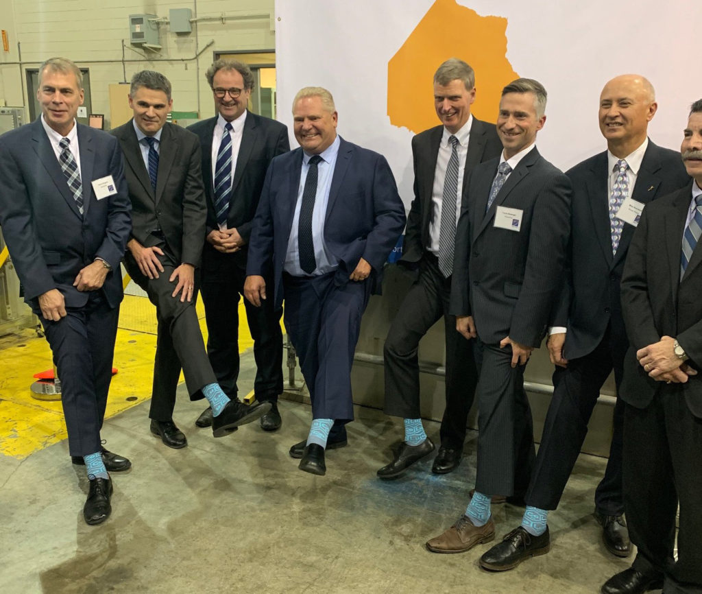 Premier Doug Ford and dignitaries show off Cobalt-60 socks