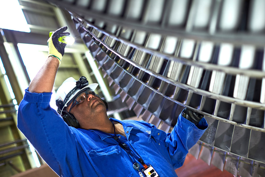 Employee inspects turbine