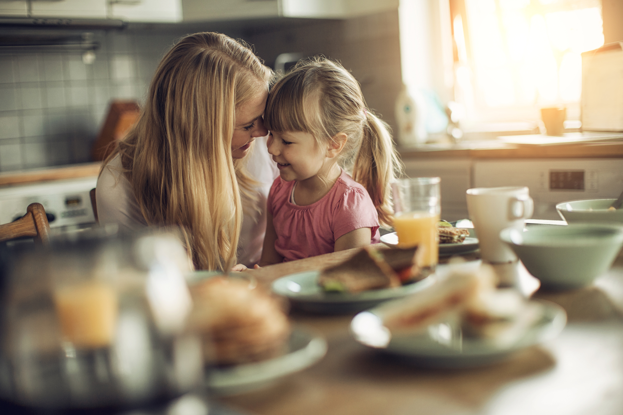 Photo of a mother and daughter having breakfast