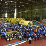 Workers gather in the Unit 3 turbine hall