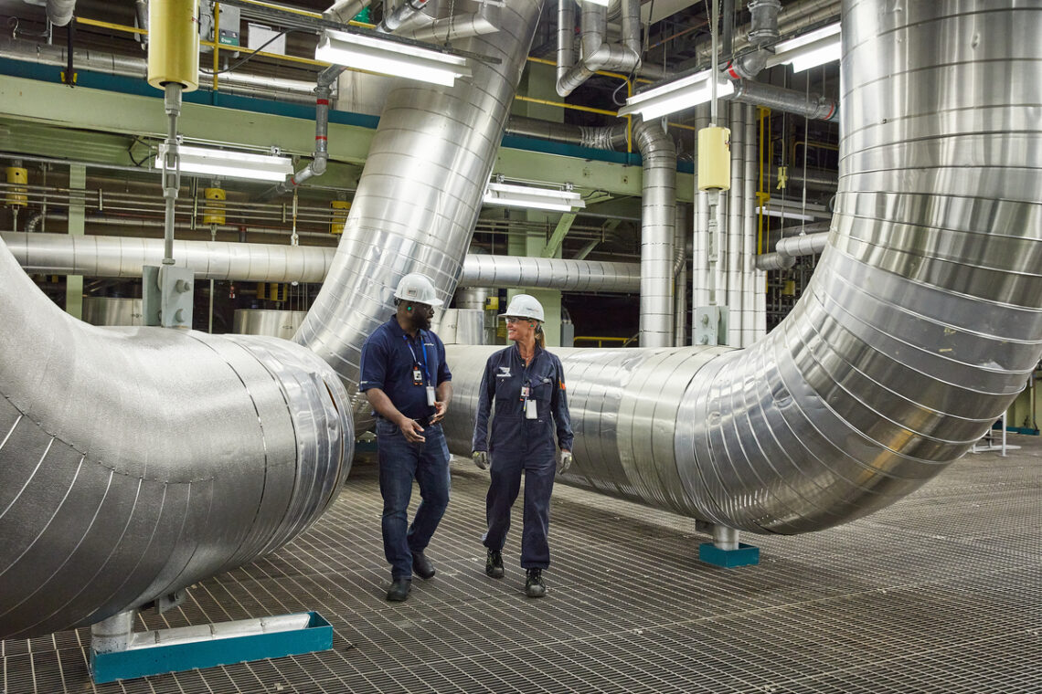 Photograph of a man and woman working inside the Bruce B station.