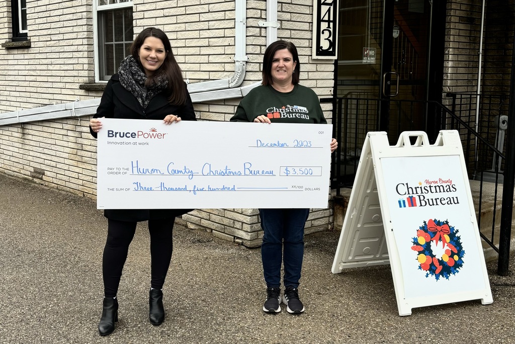 Leading up to the holidays, Bruce Power delivered donation cheques to a number of community organizations with funds raised from a holiday toy and hamper drive. Pictured is Calista Powell of Bruce Power's Community Relations team meeting with Susan Cowman from the Huron County Christmas Bureau.