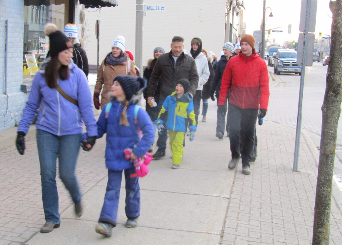 People walk in Coldest Night of the Year event in downtown Port Elgin.