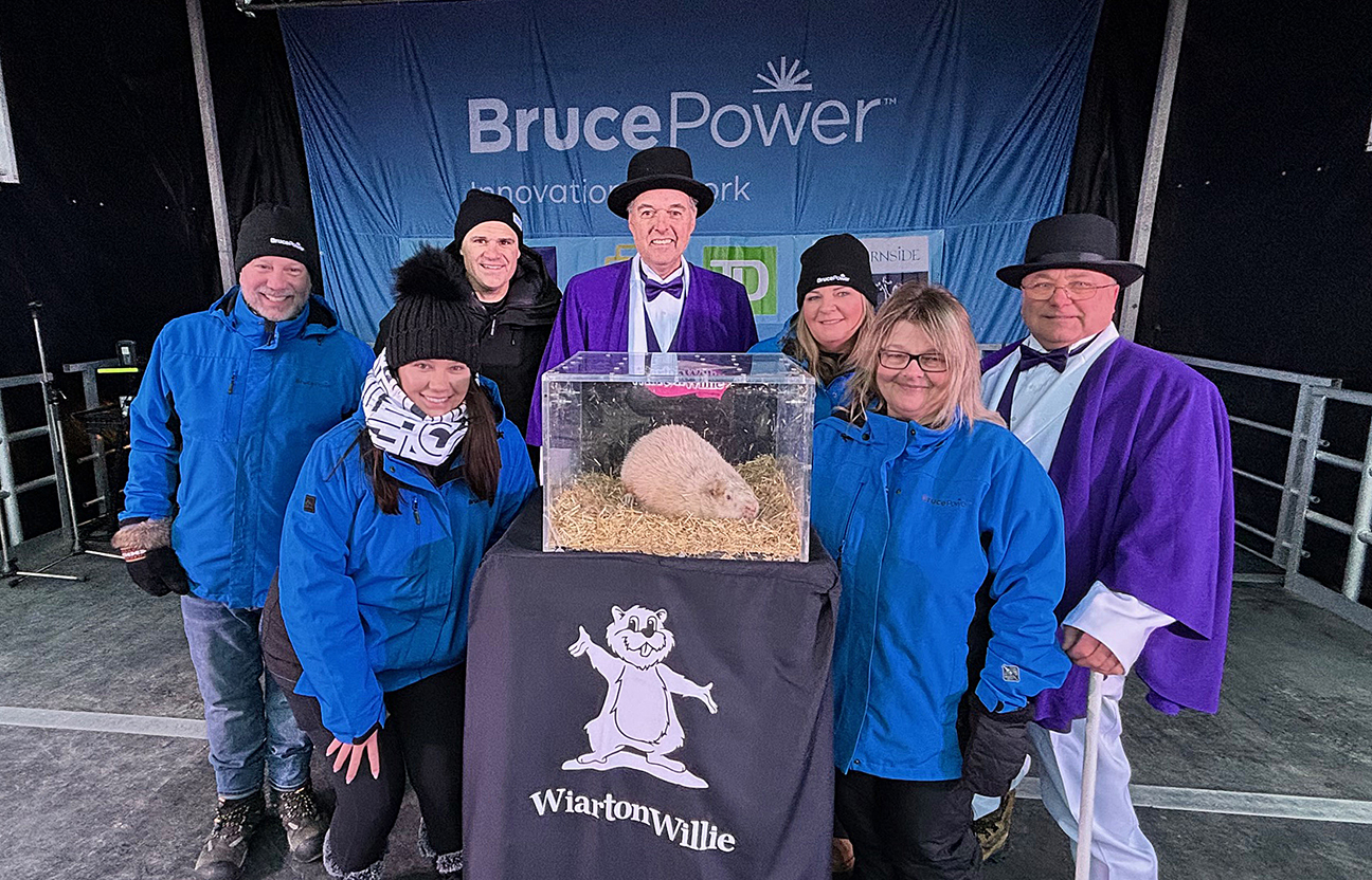 Bruce Power employees gather around Wiarton Willie as he makes his annual prediction.