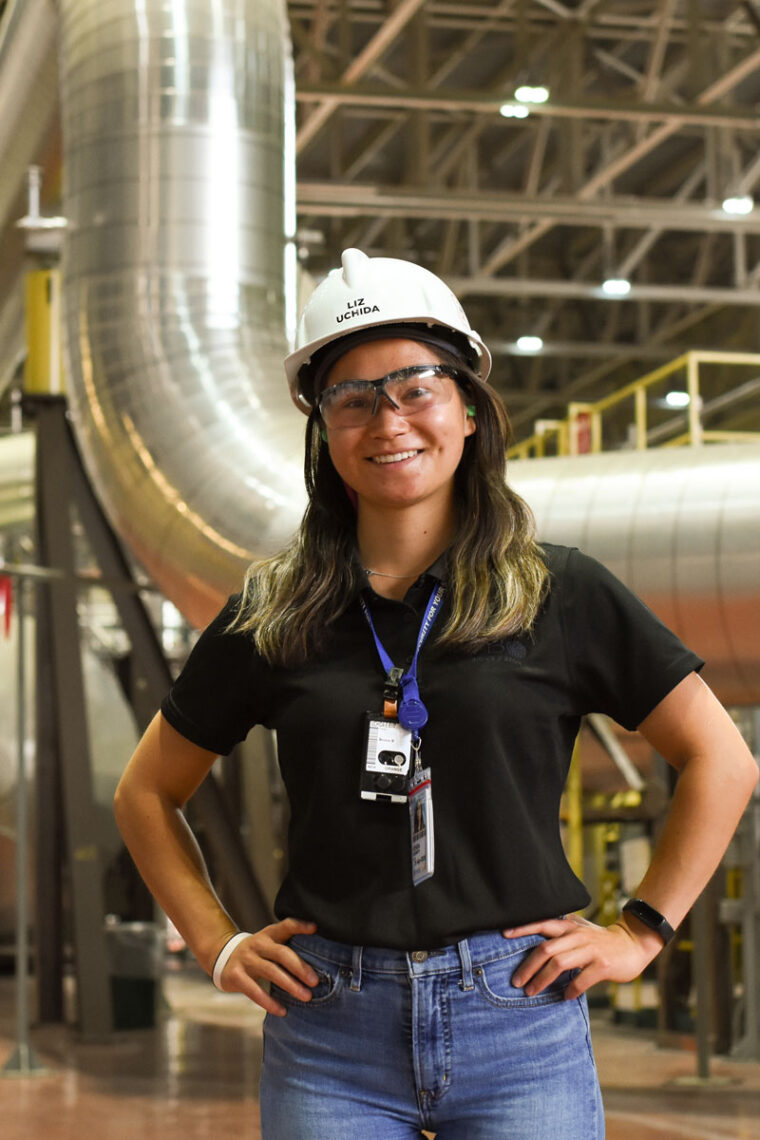 Photograph of Liz Uchida standing inside one of the Bruce Power stations.