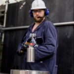 Bruce Power Isotope Production System worker loading a target into the system.