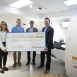 Bruce Power will donate $95,000 in funding over the next three years to study the future of stereotactic radiosurgery, which focuses on saving lives and improving patient outcomes by destroying tumours without surgery. From left are Bruce Power’s Jenny Boyadjian, Isotope Expansion Manager, and Peter McDermid, Director, Isotope Business Development; Dr. Arjun Sahgal, Chief, Radiation Oncology, Odette Cancer Program, Sunnybrook Health Sciences Centre; and Pat Dalzell, Bruce Power’s Vice-President, Corporate Affairs and Market Development. (Photo by Kevin Van Paassen/Sunnybrook)