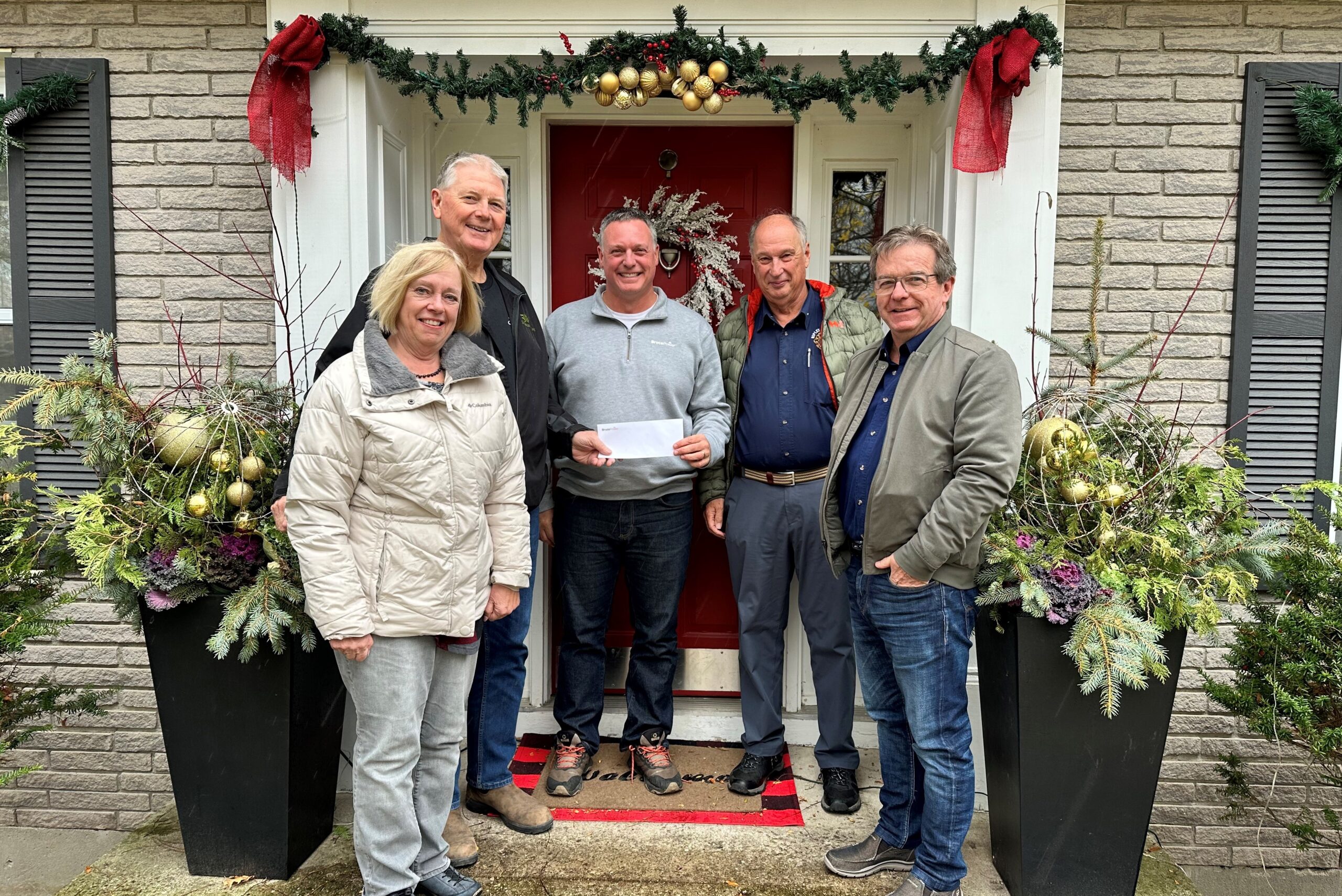 Dwight Irwin, middle, Bruce Power's Manager of Community Relations, presents a ,000 cheque to the Ripley Lions Club for its holiday hamper program. Club members and hamper program volunteers include Ann Miller, left, John Kelly, chairperson, Ken Stanley, Secretary, and Rob Miller, president. Bruce Power and its Supplier Partners, employees and the community raised $55,000 for 19 local toy drive and hamper programs this holiday season.