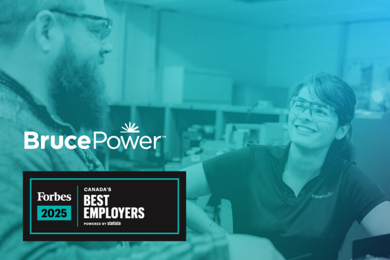 Two Bruce Power employees smile at each other at work. A Bruce Power logo is on the photo and text reads: Forbes 2025 Canada's Best Employers powered by Statista.