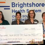 Anna Nicholson of Bruce Power, second from left, presents a donation to, from left, Amy McKinnon of the Brightshores Health System Foundation, Ann Ford, CEO Brightshores, and Dr. Laura Howlett, Lead Radiologist for CT, Brightshores.