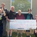Group photo of some members of the Community Living Wingham and District holding a donation cheque.