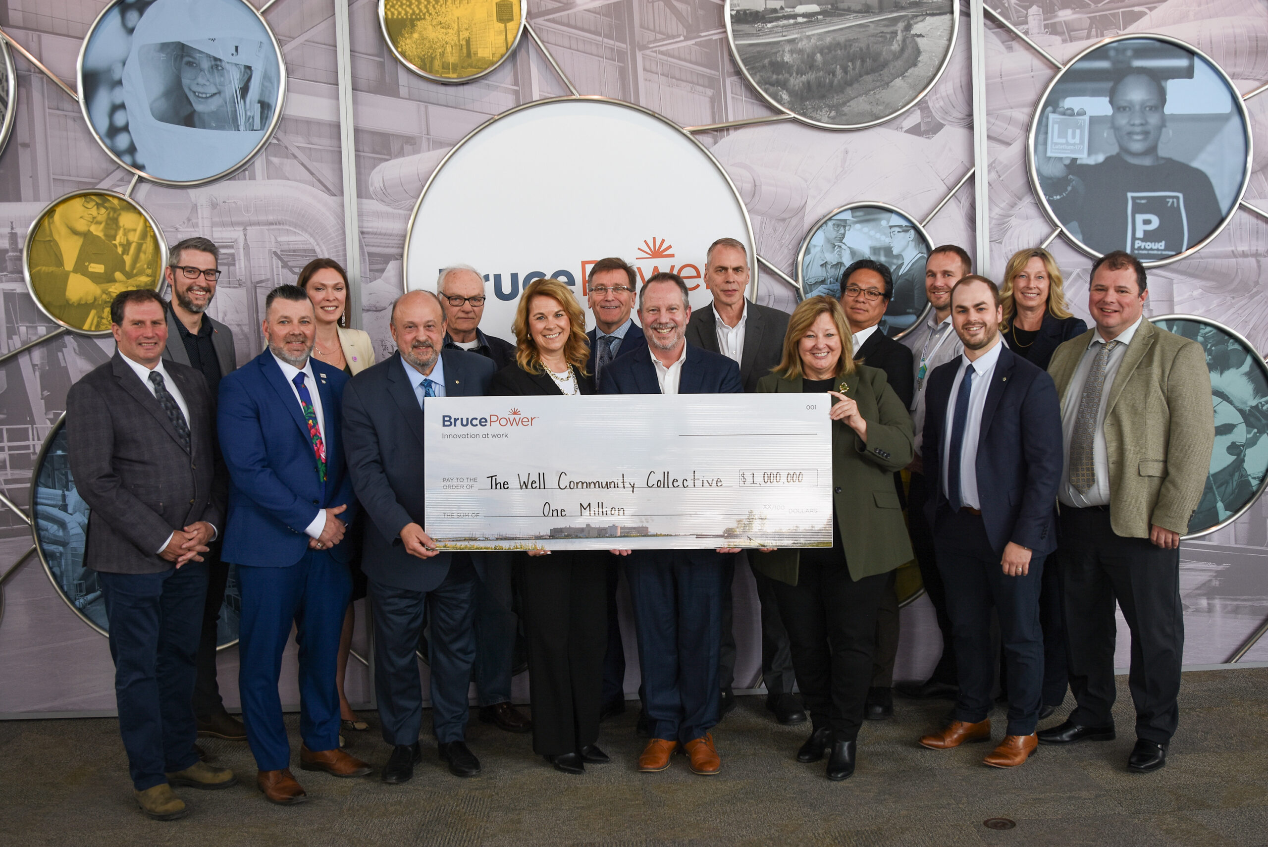 Bruce Power and dignitaries present a cheque for $1-million to the Well Community Collective.