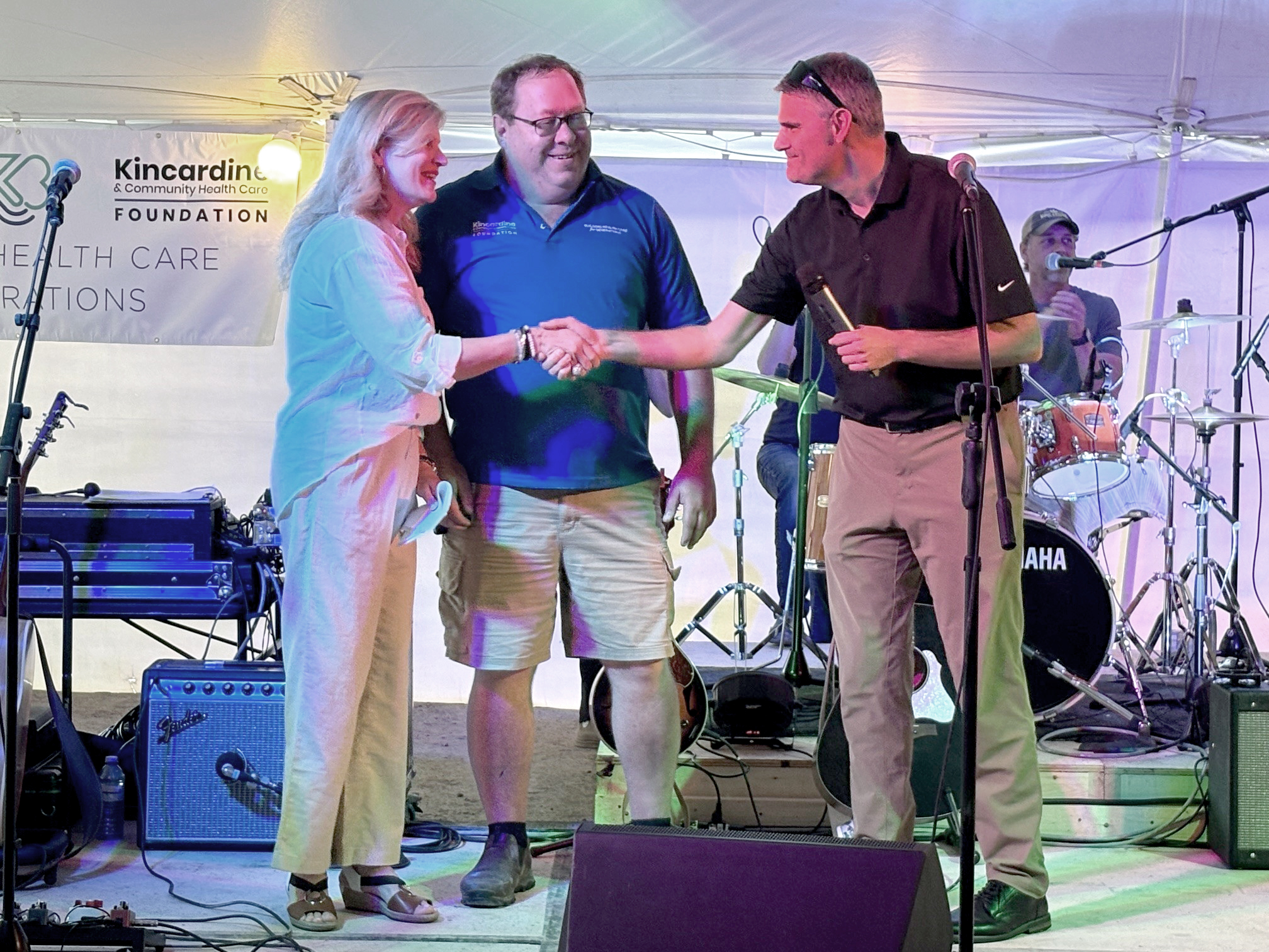 Bruce Power's James Scongack, right, announced a donation of $500,000 toward an MRI machine for Kincardine’s hospital June 20 during Rock with your Docs. Joining him on stage are Nancy Shaw, President and CEO of the South Bruce Grey Health Centre, and Mark Womack, Capital Campaign Manager, Kincardine and Community Health Care Foundation.