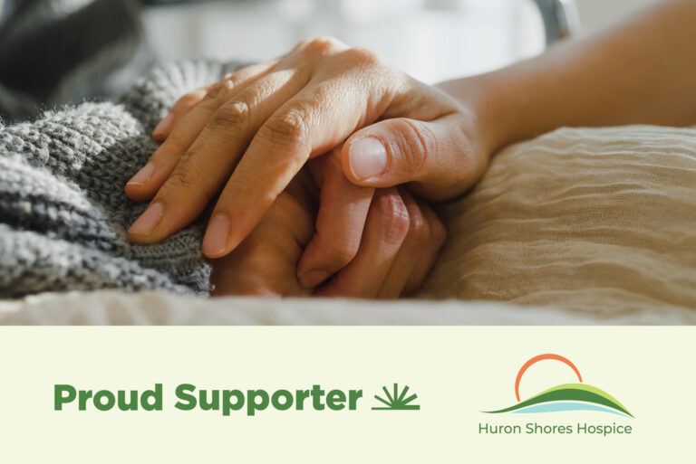 Hospice donation graphic saying proud supporter with image of hands clasping in hospice bed