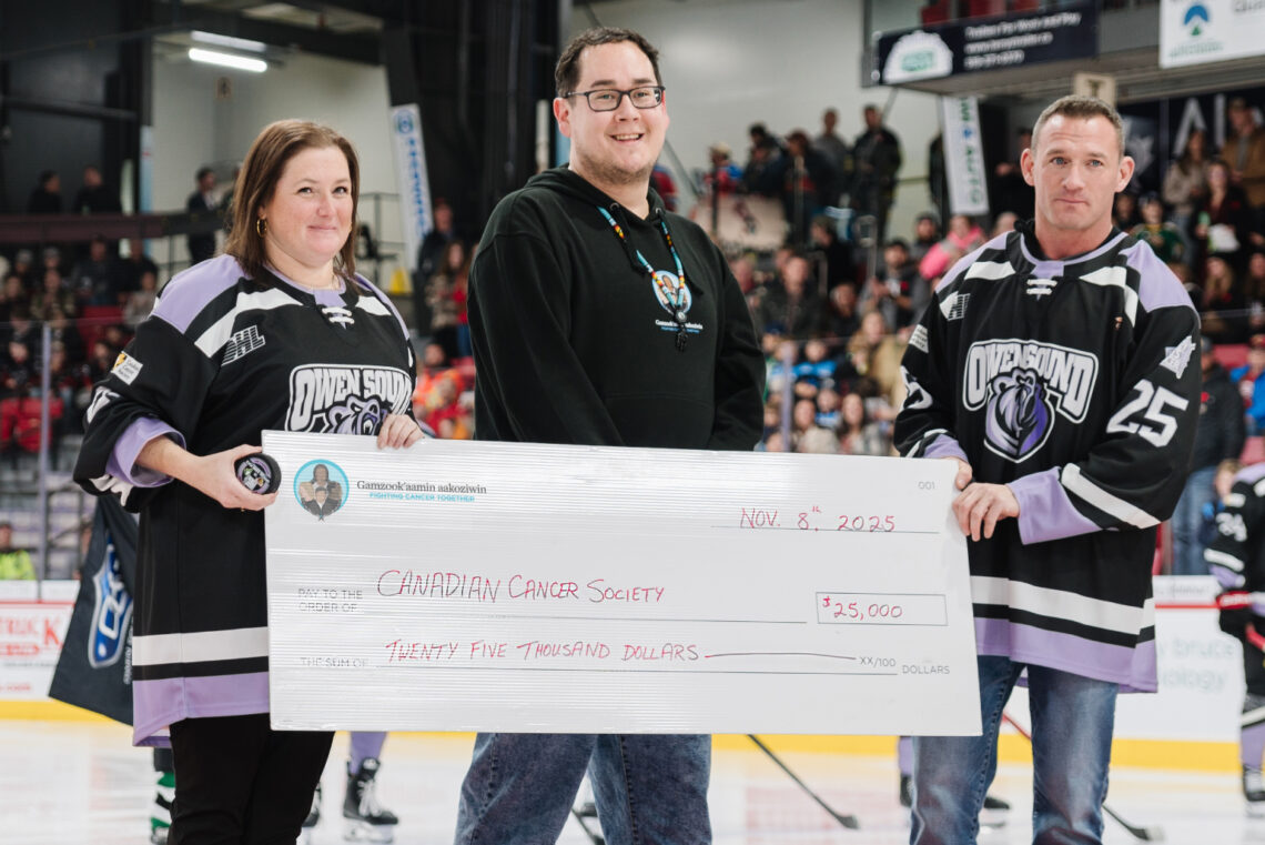 Bruce Power and the Saugeen Ojibway Nation (SON), through their Gamzook’aamin aakoziwin medical isotope partnership, donated $25,000 to the Canadian Cancer Society’s Hockey Fights Cancer fundraiser at the Nov. 8 Owen Sound Attack game. Pictured, from left, are: Allison Taylor-Misener, Cops for Cancer Specialist at Canadian Cancer Society; Michael Chegahno, Director of Gamzook’aamin aakoziwin, and Chad McLean of Bruce Power.