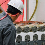 A Bruce Power worker prepares fuel bundles to be loaded into Unit 3.
