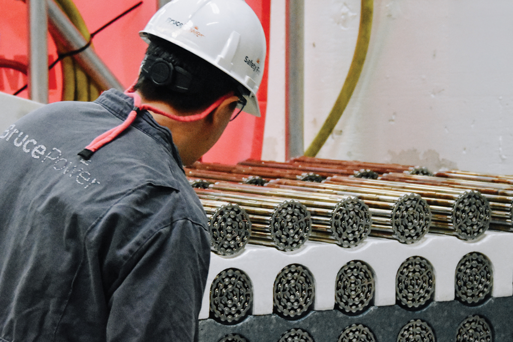 A Bruce Power worker prepares fuel bundles to be loaded into Unit 3.