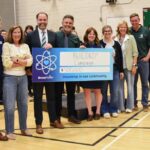 Bruce Power’s James Scongack, left, was on hand at the Kincardine District Senior School (KDSS) Banding Together concert May 14 to donate $500,000 to the BUILDKD+ campaign through the company’s Community Investment Fund.